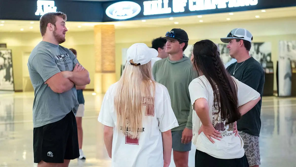 people standing around talking to each other