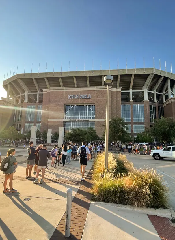 People walking up to the stadium